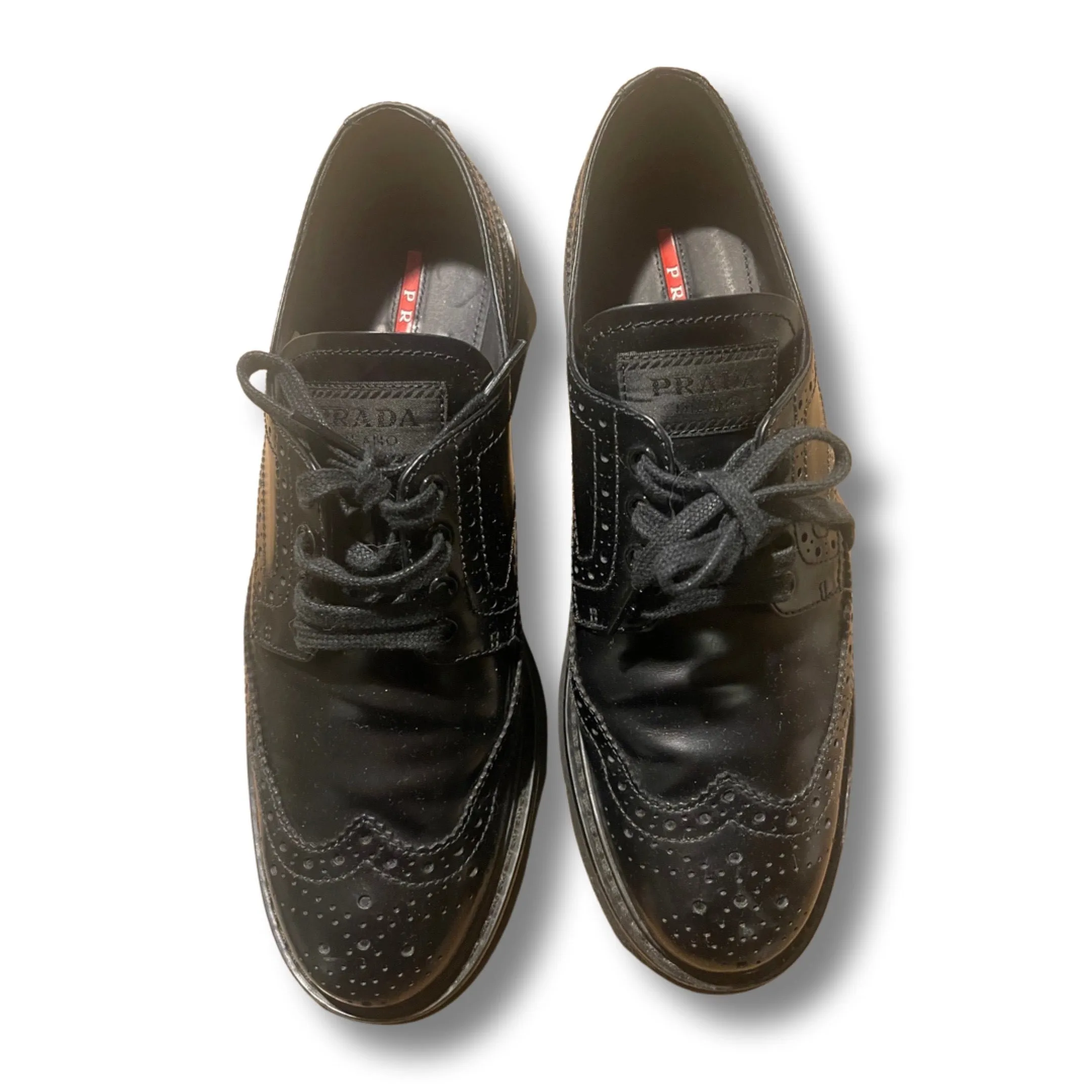 Prada brushed leather Derby shoes.